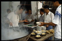 China, Henan Province, Luoning, Serving mutton soup.