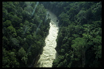 Papua New Guinea, Landscape, Aerial view over river through highland rainforest.
