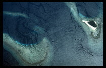 Papua New Guinea, Landscape, Aerial view over expanse of sea  island and coral.