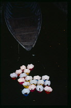 Vietnam , Central, Hoi An, Candles floating on river for the monthly Lunar Festival.