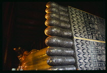 Thailand, South, Bangkok, Wat Pho giant reclining golden Buddha detail of mother of pearl embossed soles of its feet.