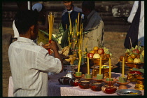 Cambodia, Siem Reap, Angkor Wat, Shaman ceremony preparing the altar with offerings of food.