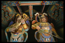 South Korea , Kyong Ju, Pulguksa Temple, Two Temple Guardians standing at the entrance to the temple.