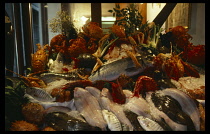 Italy, Veneto, Venice, Mixed fish and seafood on ice outside a restaurant.