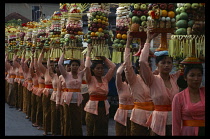 Indonesia, Bali, Mas, Near Ubud women in procession Mep-ed to temple carrying elaborate offreings at the Kuningan Festival.