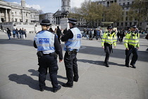England, London, Police and Liason officers on patrol in Trafalgar Square.