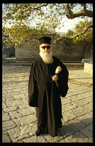 Greece, Monodhendhri, Priest in black robes.