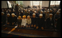 China, Lanzhou, Islamic, Praying in Mosque at end of Ramadan festival.