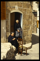 Spain, Majorca, Pollensa widows outside house.
