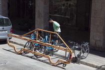 Spain, Balearic Islands, Majorca, Palma de Mallorca, Bike stand designed to occupy a single car parking space.