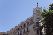 Spain, Balearic Islands, Majorca, Palma de Mallorca, Exterior of the former Gran Hotel designed by Lluís Domènech i Montaner, now a cultural centre Fundación la Caixa and is an example of Catalan M...