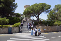 Spain, Balearic Islands, Majorca, Palma de Mallorca, Castle Bellver with wedding party taking photos on the steps.