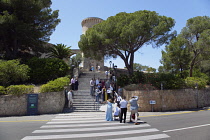 Spain, Balearic Islands, Majorca, Palma de Mallorca, Castle Bellver with wedding party taking photos on the steps.