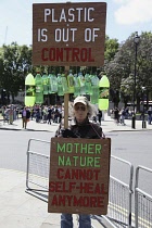 England, London, Parliament Square, Environmental protestor against plastic use.