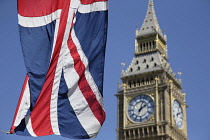 England, London, Parliament, Recently cleaned Big Ben with the Union Jack flag flying in the fioreground.