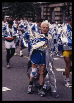 Sport, Athletics, Veteran Runner in foil blanket at the finish of the London Marathon.
