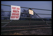England, Farming, Metal gate with notices prohibiting entry due to Foot and Mouth disease.