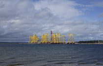 Scotland, Highlands, Cromarty Firth, Wind Farm bases outside factory.