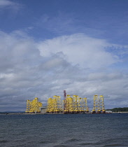 Scotland, Highlands, Cromarty Firth, Wind Farm bases outside factory.