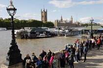 England, London, Mourners queueing along the banks of the river Thames to see the coffin of Queen Elizabeth II laying state in Westminster Hall.