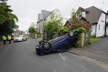 Transport, Road, Cars, Road Traffic Accident, Car overturned in urban street.