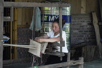 Vietnam, Lào Cai Province, close to Sa Pa, Woman weaving.