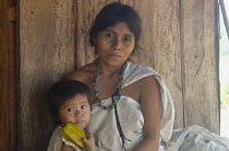 Colombia, Sierra Nevada, close to Palomino, Ika woman with child.