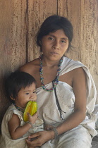 Colombia, Sierra Nevada, close to Palomino, Ika woman with child.