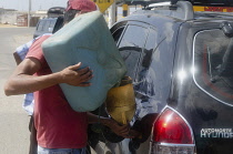 Colombia, Guajira, Refuelling of a vehicle.