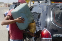 Colombia, Guajira, Refuelling of a vehicle.