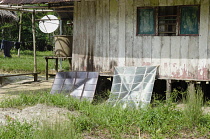 Colombia , Piraparana, Solar panels with a telecommunications dish behind.