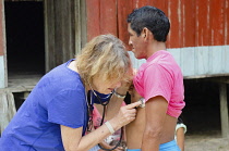Colombia , Piraparana, San Miguel, Anthrpolologist and doctor Christine Hugh-Jones checks health of a local Tukano indian.