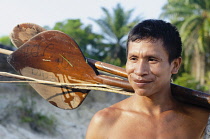 Colombia, Piraparana, Piedra Ni, Tukano indian with paddle.