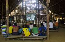 Colombia, Piraparana, Pidera Ni, Tukano indians watch the film Piraparana made about their ancestors in 1961 by Brian Moser.