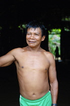 Colombia , Piraparna, Sta. Isabel, Tukano man looking oout of his maloca.