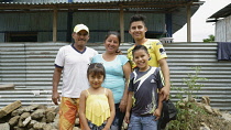 Ecuador, Carolina and her family outside their house on the outskirts of Guayaquil.