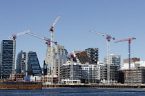 Norway, Oslo ÂBar CodeÂcommercial district with construction cranes in the foreground.