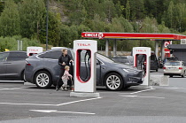 Norway, Tesla vehicle being recharged at a Tesla charging station.