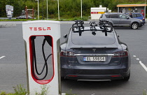 Norway, Tesla vehicle being recharged at a Tesla charging station.