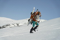 Norway-, Hemsedal, Back-country skier ascending Slettind mountain.