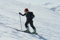 Norway-, Hemsedal, Back-country skier ascending Slettind mountain.