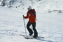 Norway-, Hemsedal, Back-country skier ascending Slettind mountain.