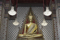 Thailand, Bangkok, Budda statue inside Wat Arun Ratchawaram temple.
