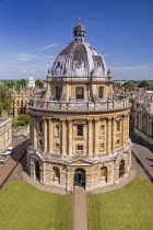 England, Oxfordshire, Oxford, Radcliffe Camera which is an iconic Oxford landmark and a working library, part of the central Bodleian Library complex, viewed here from the tower of the University Chur...