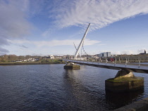 Ireland, North, Derry City, The Peace Bridge acrosss the River Foyle.