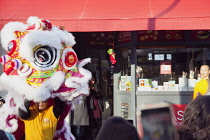 Portland Road, Dragon dance outside Asiana shop for Chinese New Year 2023, the year of the Rabbit.