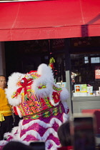 Portland Road, Dragon dance outside Asiana shop for Chinese New Year 2023, the year of the Rabbit.