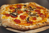 Food, Cooked, Pizza, Mushroom and Pepperoni Pizza in La Tavola Italian Eatery in Southwick, West Sussex, England.