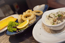 Food, Cooked, Calamari Frito, Battered and deep fried Squid rings, La Tavola Italian Eatery, Southwick, West Sussex, England.