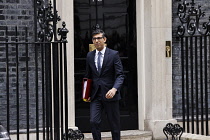 England, London, Conservative Prime Minister exiting the door of number 10 Downing Street.